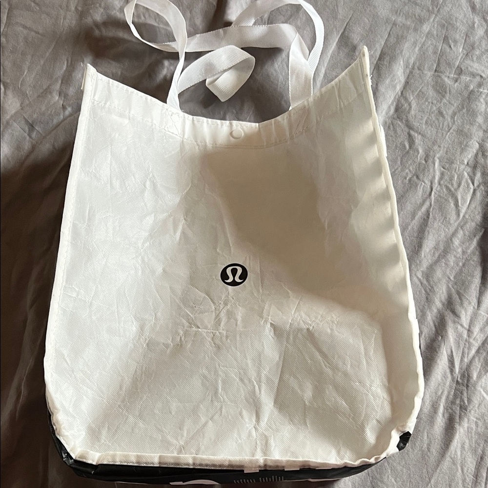 Lululemon reusable shopping bag. Black and white. 14x16 inches w/ snap closure.